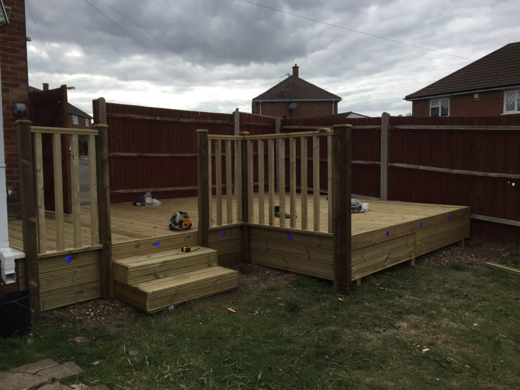 Raised outdoor seating area with steps and balustrade