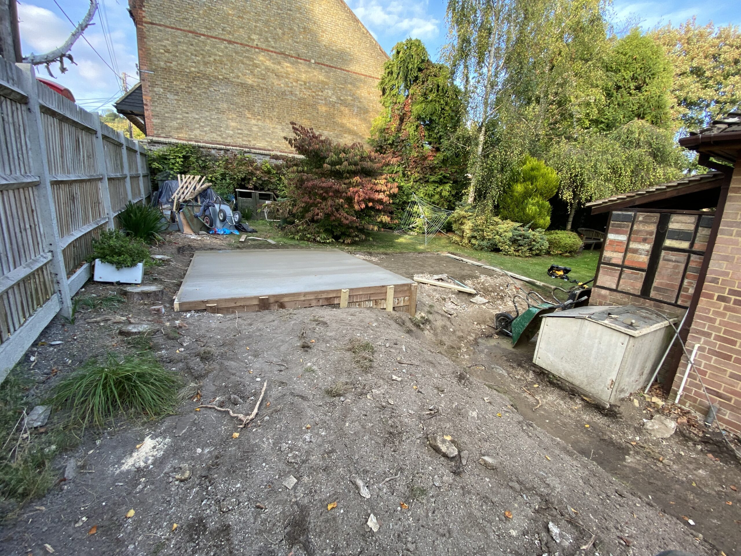 Concrete base installed at the end of a garden