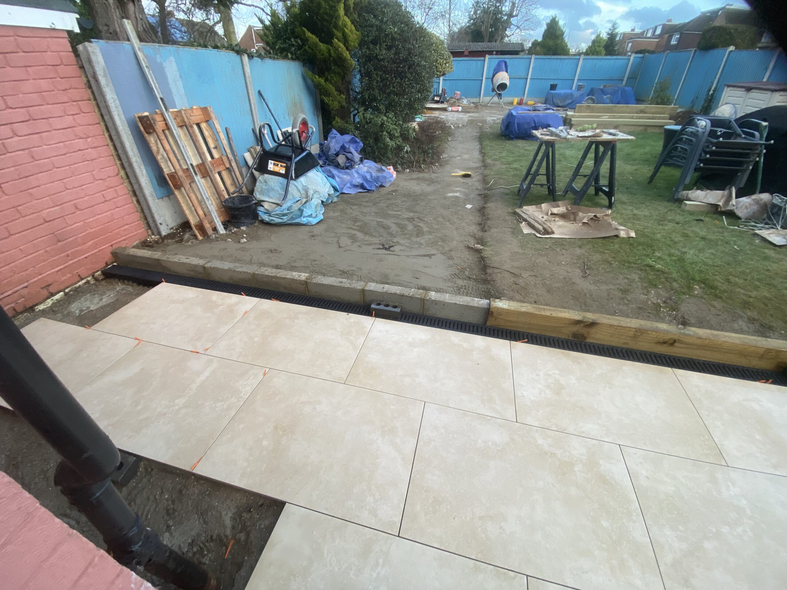Porcelain patio installation with slabs laid on prepared base