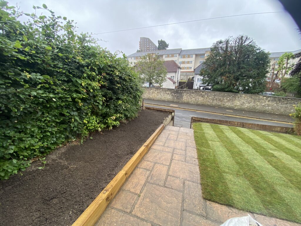 New turf lawn beside a paved garden path in Maidstone