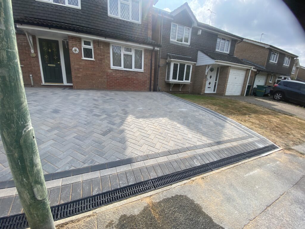 Grey block paving driveway with drainage channel in Maidstone